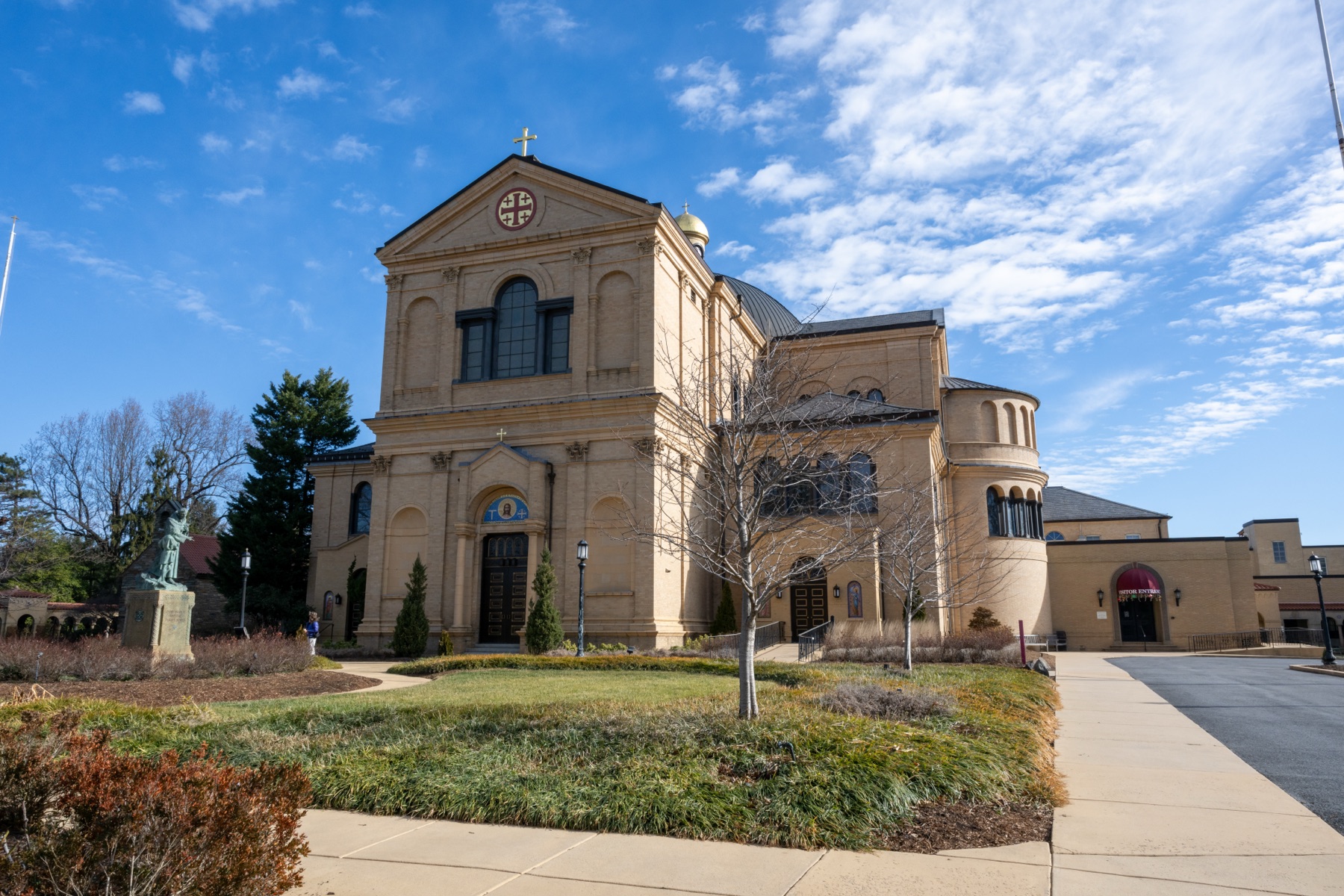 Exterior of the Memorial Church of the Holy Sepulcher at the Franciscan Monastery of the Holy Land in America, on a sunny day