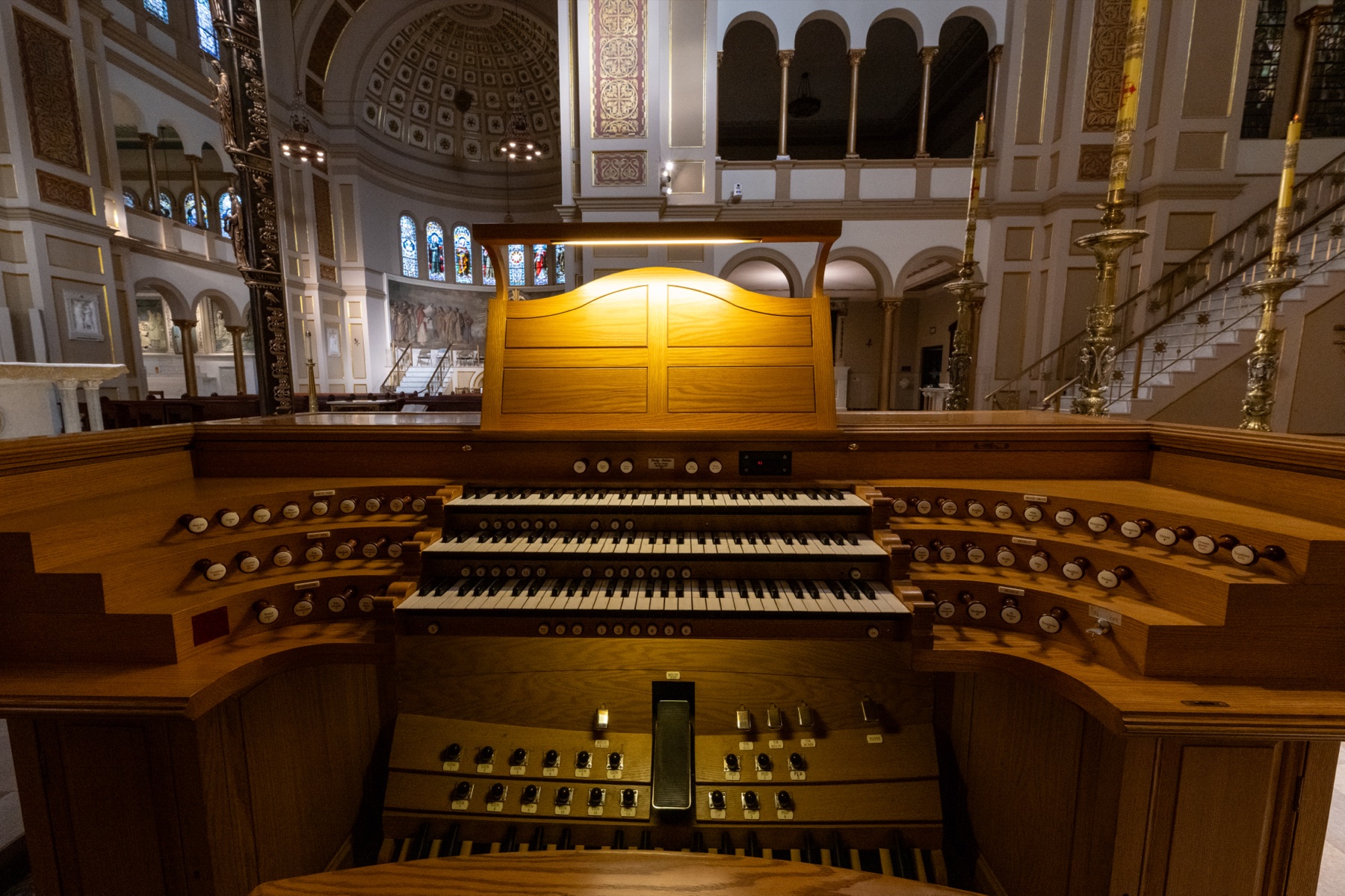 The three-manual console of the Lively-Fulcher organ, with curved terraced stop jambs, overlooking the church interior
